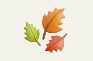 Image shows autumn leaves on cream background
